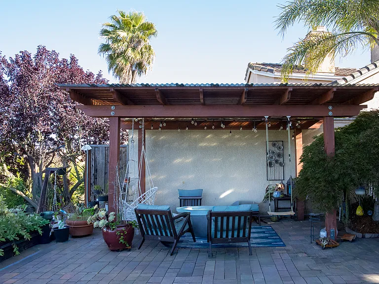 Pergola seating and mature Japanese Weeping Maple tree