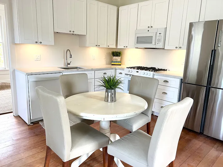 Newly renovated kitchen with dishwasher, gas range, microwave and washer/dryer