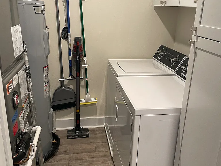 Utility room w/ washer/dryer & additional storage