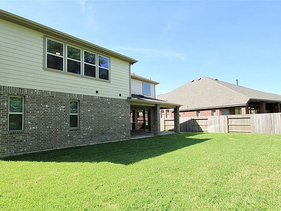 This is the Back of the Home offering a Covered Patio.