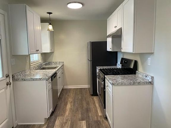 New kitchen with dishwasher and disposal.