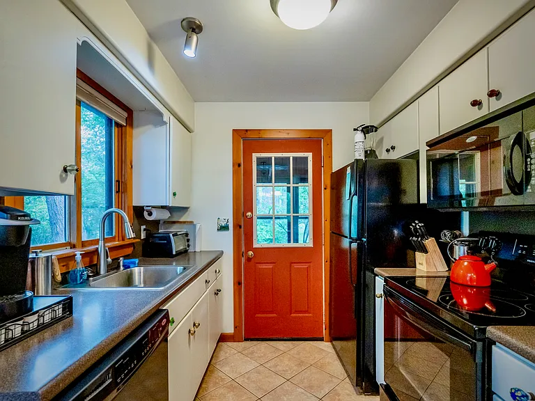 Well-equipped kitchen with ample counter space, full appliances, and a bright, practical layout for everyday living.