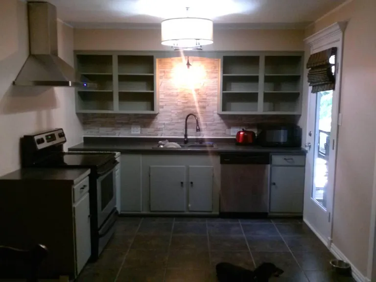 kitchen, comes fully stocked with appliances: toaster, blender, food processor, microwave, toaster oven, coffee maker, coffee grinder, icecream maker, Kitchenaid x2.