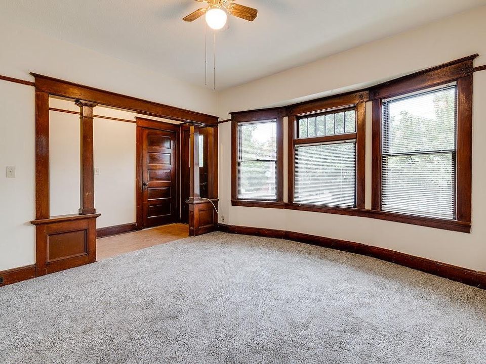 Living room facing toward entry and closet
