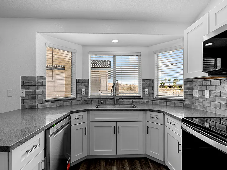 Beautifully remodeled kitchen with bay window and all new appliances.