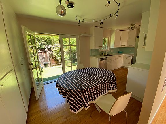 Dining area with door to private backyard.
