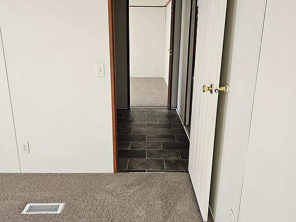 Exiting bedroom 3 going into bedroom 4