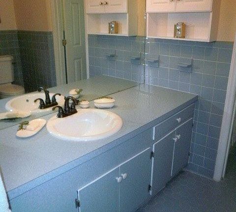 Bath with large counter area and linen closet.