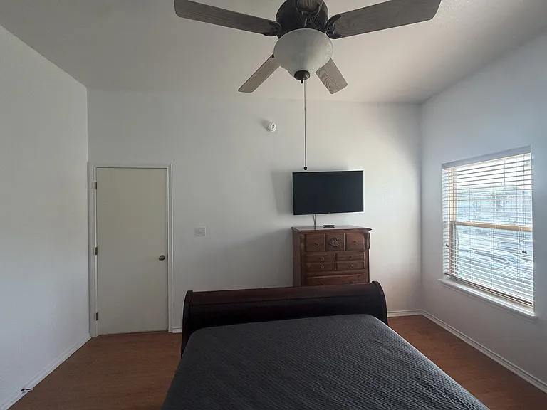 Primary bedroom. TV dress, and bed with mattress and mattress protector included.