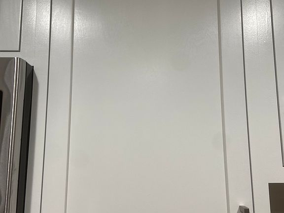 Interior -- Shaker style of renovated cabinets with brushed nickel handles