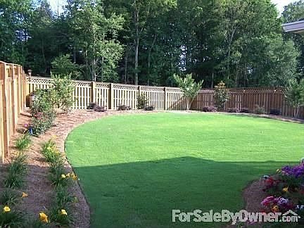 Professionally Landscaped Backyard
						:
						Plants include tea olives, magnolias, crepe myrtles, gardenias.