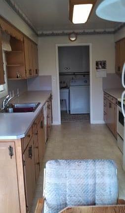 View from nook into kitchen and laundry beyond