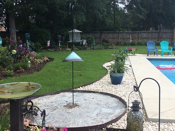 Concrete pad beneath feeder