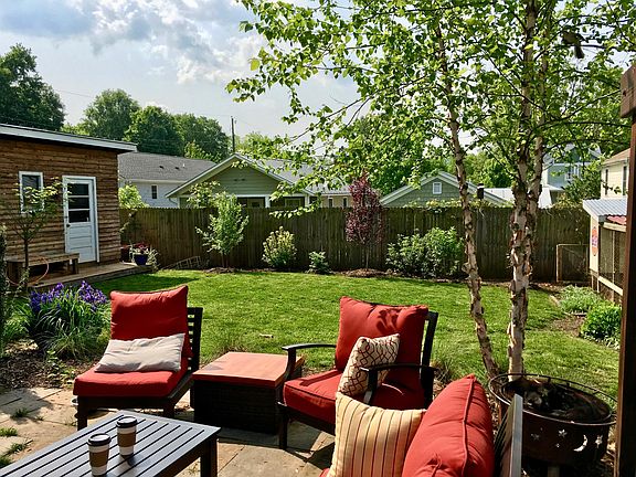 Backyard patio and landscaped yard