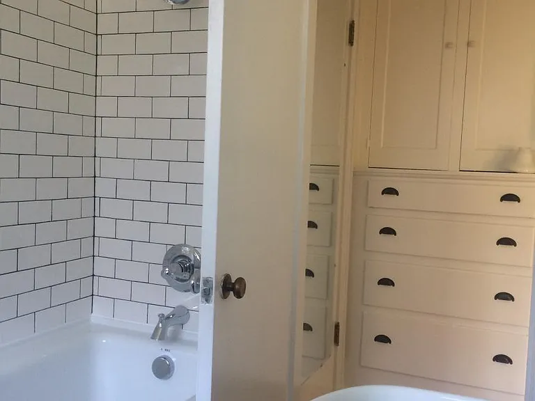 Looking out of the bathroom to hallway with original built i