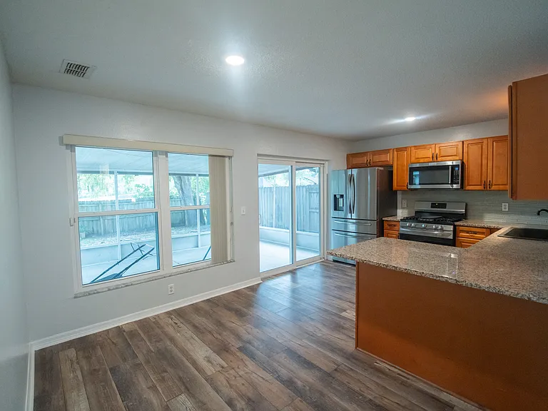 Kitchen, with windows facing the patio