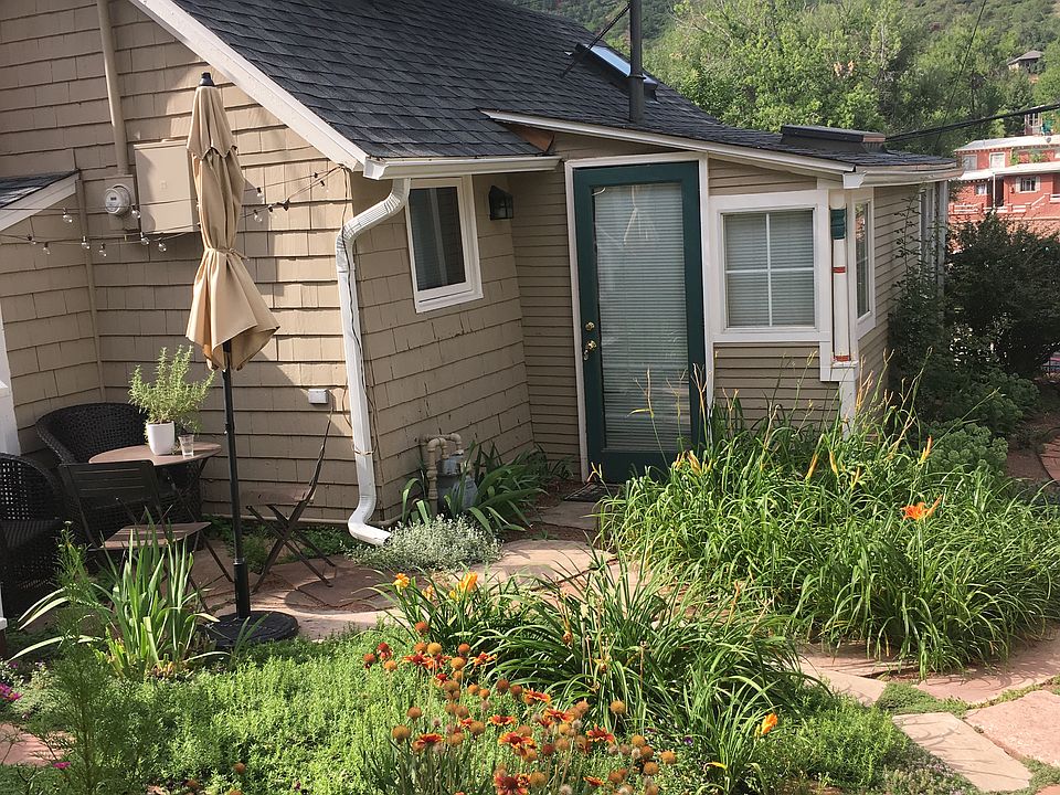 front door of cottage with garden