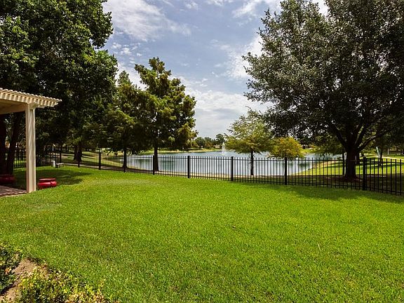 View of the back yard to the lake and fountain! Enjoy!