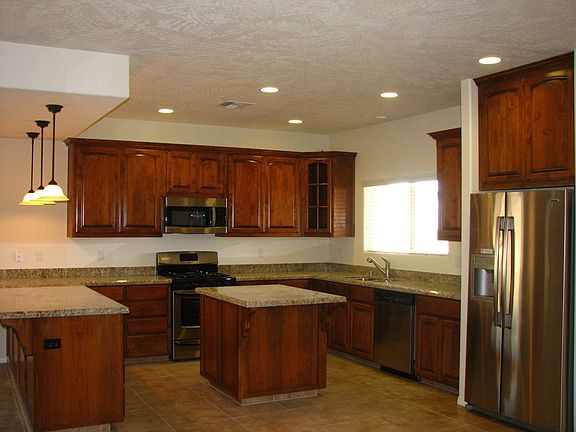 Amazing kitchen with tile flooring, granite counters and ss appliances
