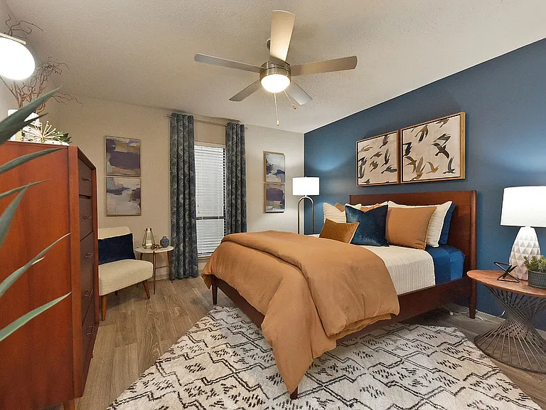 Bedroom with hardwood-style flooring