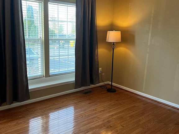 Warm family room with plenty of light from front windows