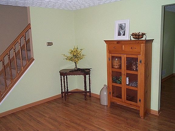 Living room adjoins front stair & dining room