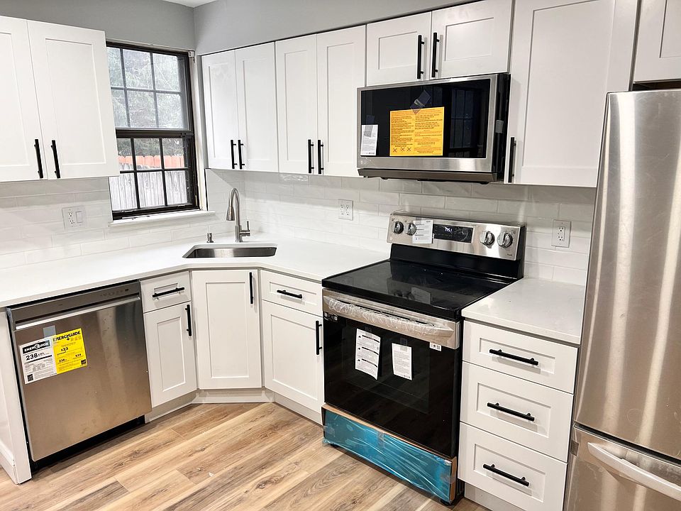 Designer Kitchen with all new stainless steel appliances including stove, microwave, dishwasher, and French Door fridge. Soft close cabinets; Garbage disposal