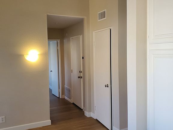 Facing downstairs hallway from kitchen