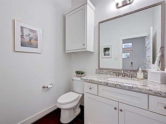 A half bath located right as you enter.