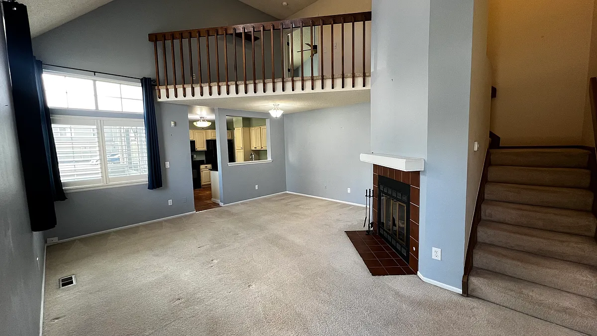 Great room with in door balcony and natural wood fireplace - 7370 E Florida Ave #1007