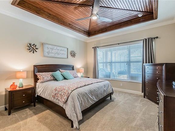 I bet I know where your eyes went first.... this one of a kind wood paneled tray ceiling makes the Master bedroom a thing of bea
