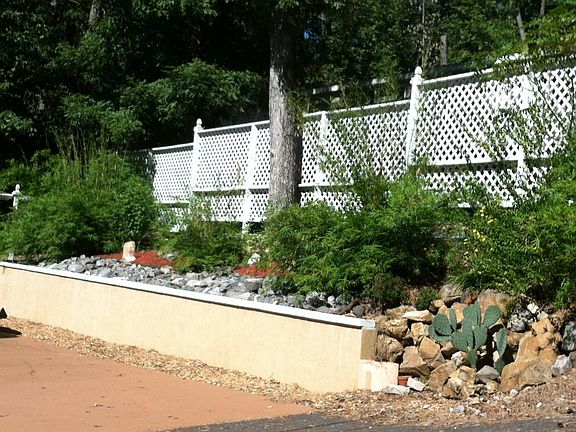 Hill side /driveway with privacy fence
