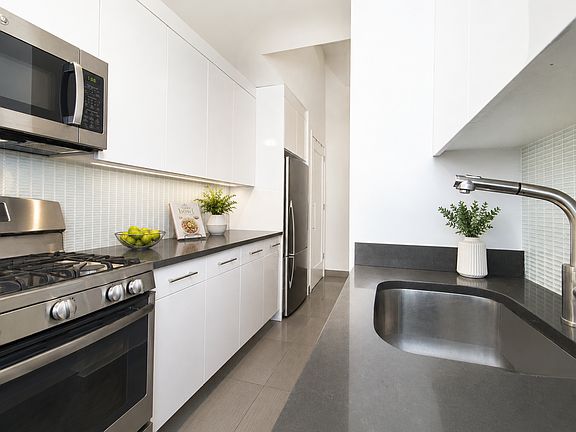 5th image of 310 E 46th St APT 7