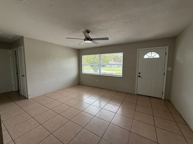 View is standing and looking at the front door