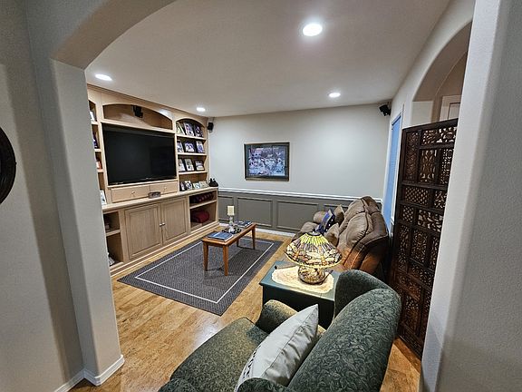 Family room with built in entertainment system. TV and Bose surround sound to stay!