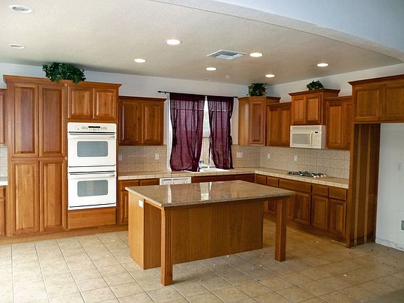 Big kitchen with granite counters and tile floors