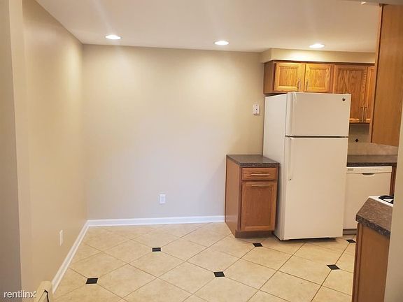 Eating area in kitchen. Marble floors.