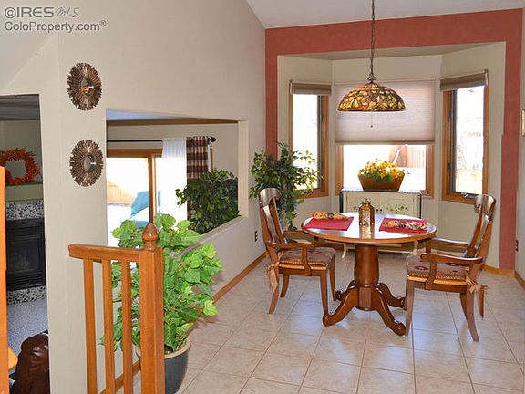 Tiled dining area with bay window.