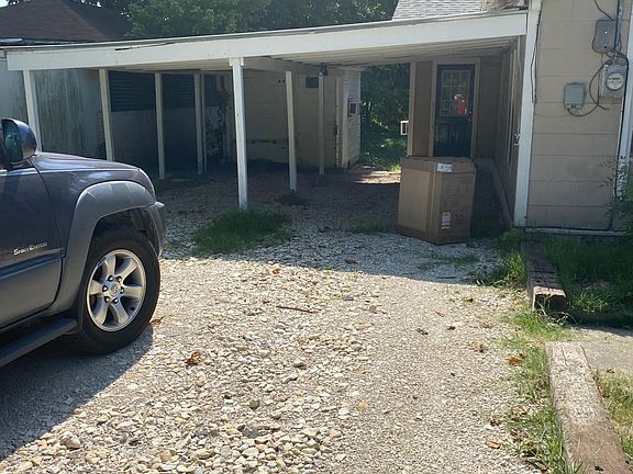 2 vehicle carport, small shed behind for storage