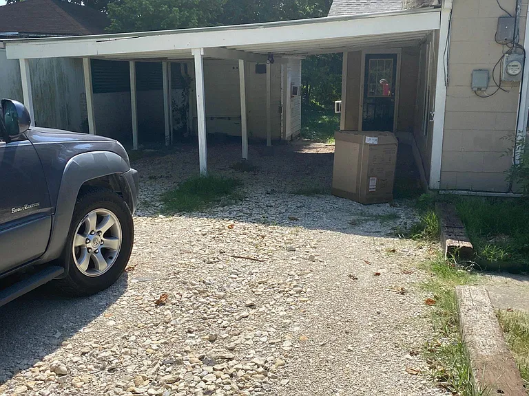 2 vehicle carport, small shed behind for storage