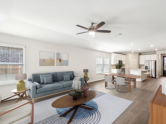 Virtually staged living room in the Allen floorplan at a Meritage Homes community.