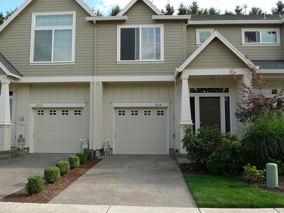 front view with oversize single car garage and plenty of off street parkings