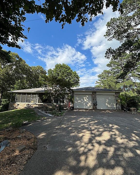 Brick, Cypress and Rock Home