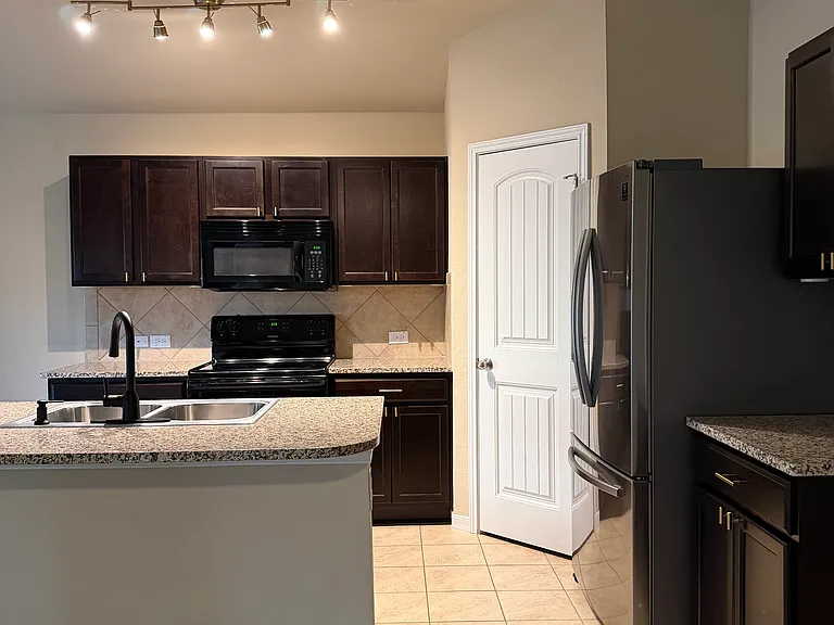 Kitchen with included fridge