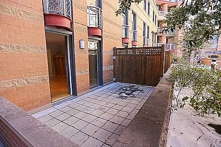 Two large glass doors opening to a great private patio in quiet courtyard