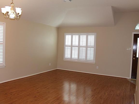 The windows have shutters for an upscale look.