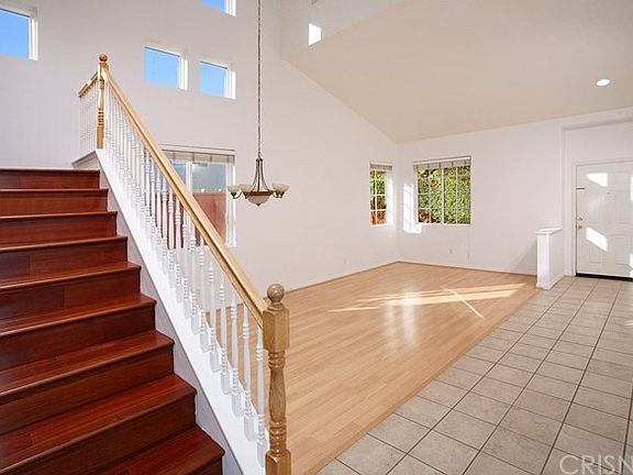 The formal living room is bathed in natural light