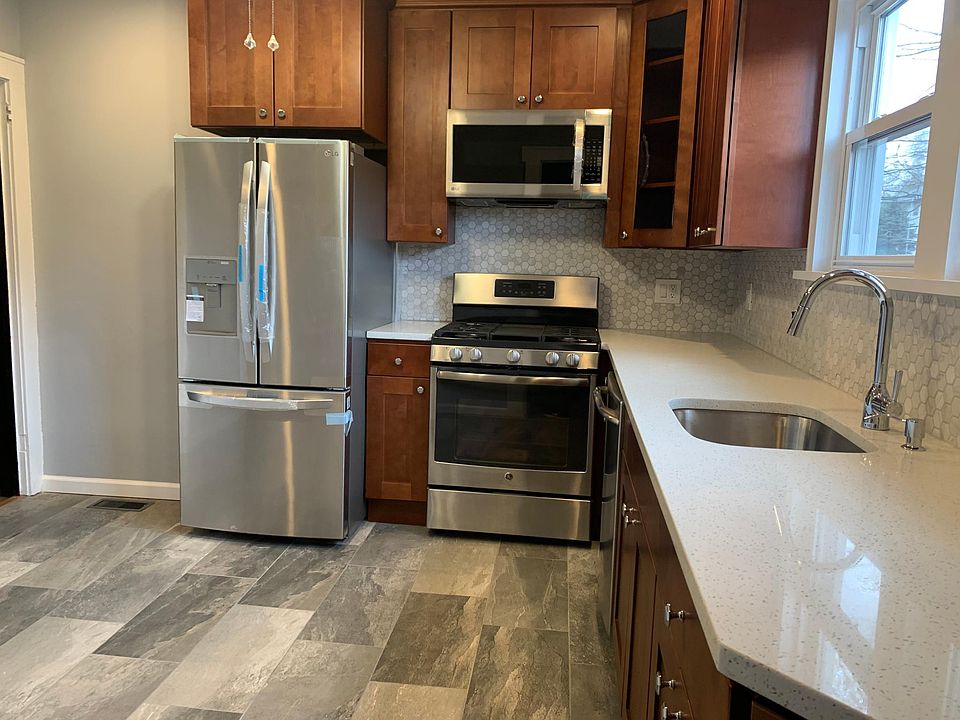 Brand new eat in kitchen with SS appliances and custom cabinetry