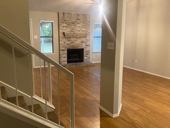 Gorgeous flooring and freshly painted interior! View from the kitchen!