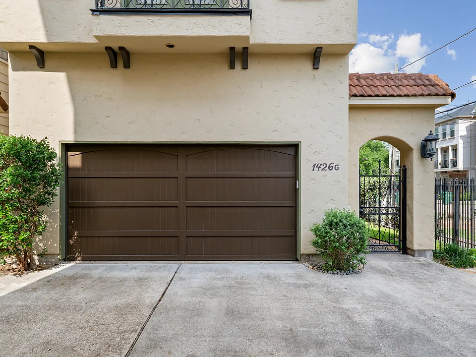 Features a two-car front garage with private gated entryway leading to front door of property.